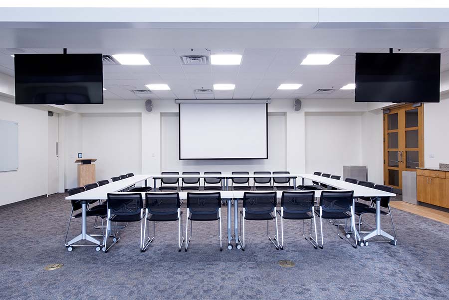 Photo of the Danforth Conference Room facing the TV monitors and projection screen